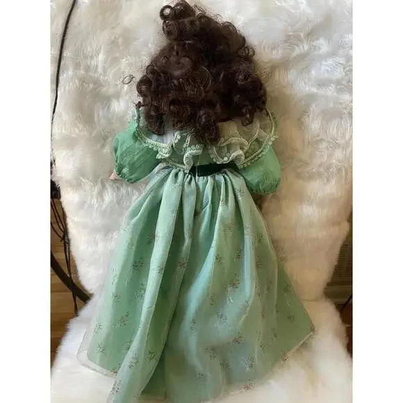 Vintage Porcelain Doll with Curly Brown Hair in Green Dress -  www.disolcolor.com